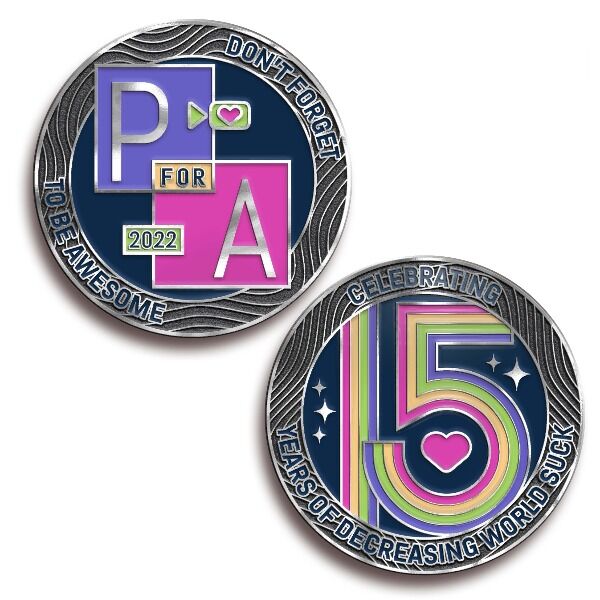 Commemorate the 15th Project for Awesome with this colorful 1.5" metal silver plated coin designed by Maddie Go.