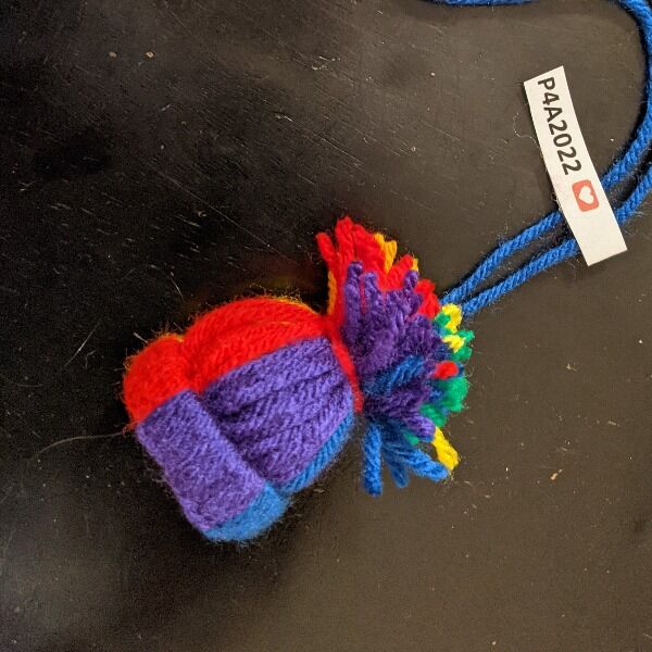 A rainbow pride hat ornament handcrafted by Nerdfighter Alex, a This Star Won't Go Out volunteer.