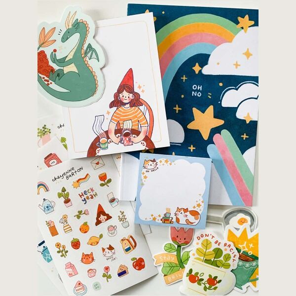 Get a stationary-lover bundle including 2 notebooks, 3 notepads, 5 sticker sheets, and 3-5 die cut stickers designed by artist Cheyenne Barton.