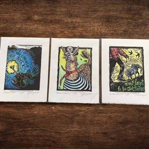 A beautiful woodblock print with vibrant watercolors created by Claire Emery! You'll receive a Hanklerfish, French Llama, or a puppy sized elephant print.