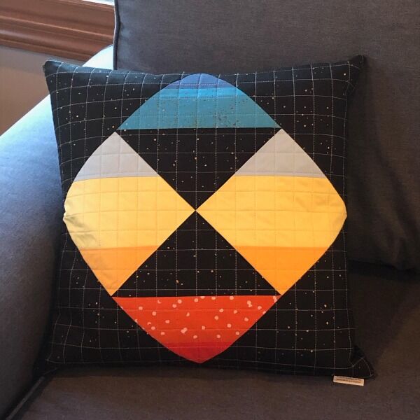 2 quilted throw pillow covers designed by nerdfighter April Singleton (IG april_singleton)