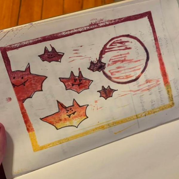 A linoleum-block-printed bat by Taylor Behnke!