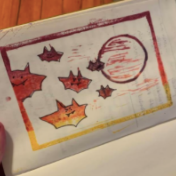 A linoleum-block-printed bat by Taylor Behnke!